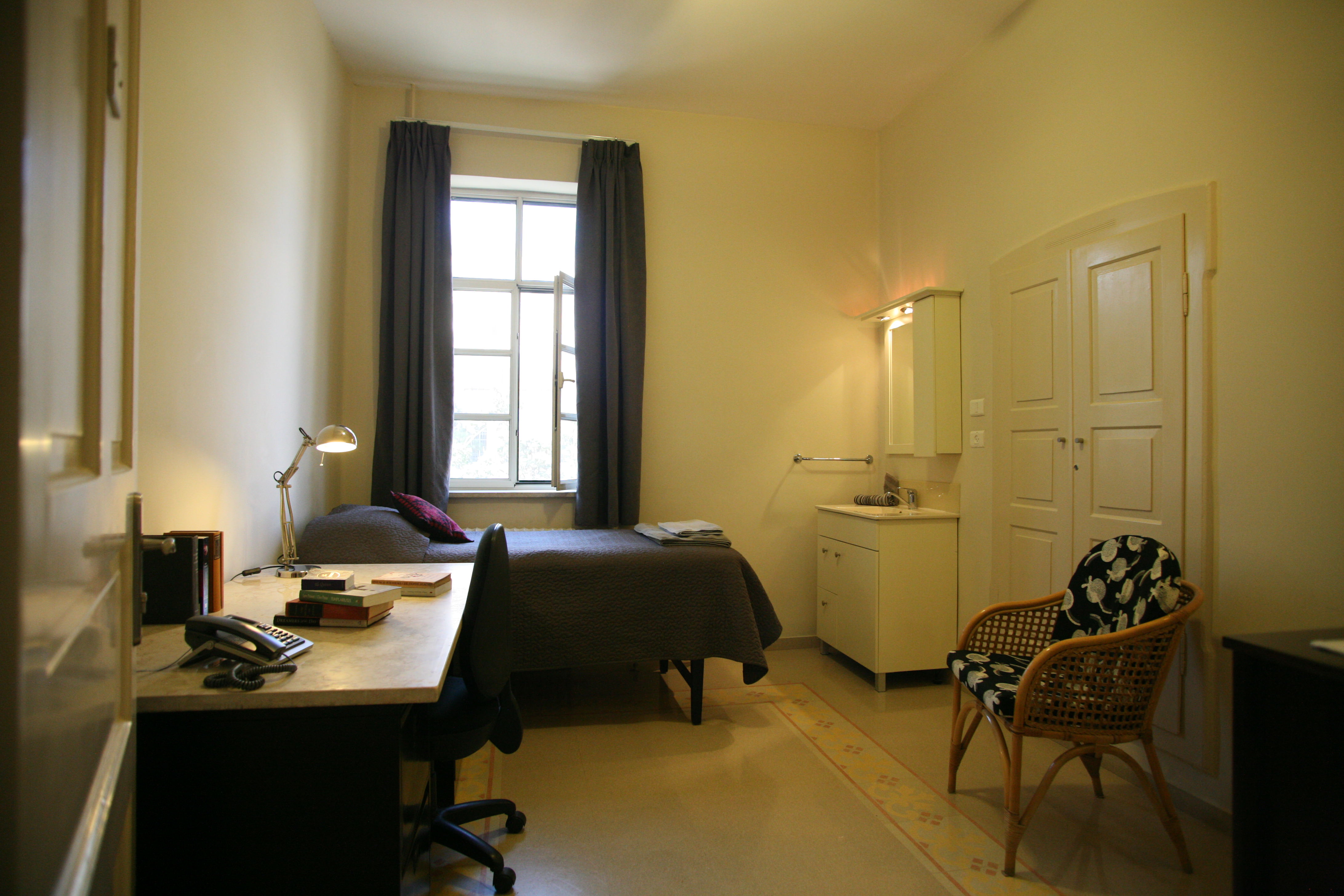 Single regular hostel room with shared bath